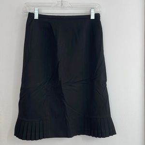 Black pencil skirt with pleated hem details